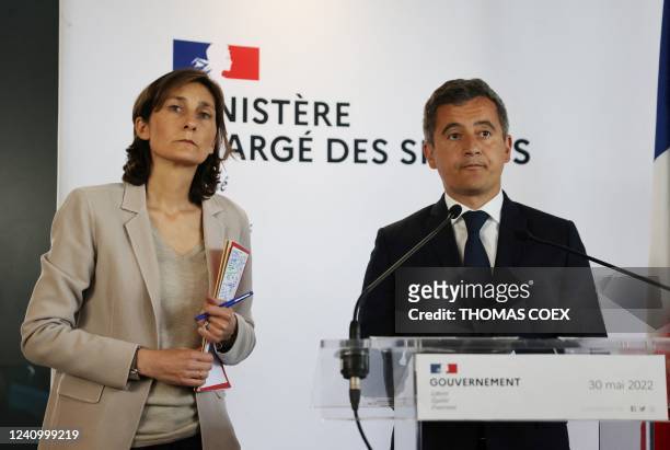 French Interior Minister Gerald Darmanin speaks next to French Sports, Olympic and Paralympic Games Minister Amelie Oudea-Castera after a meeting at...