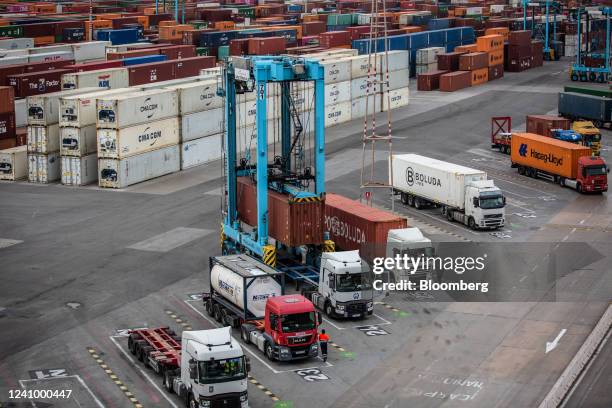 Shipping container is loaded onto a truck at the Muelle Sur terminal, operated by APM Terminals, at the Port of Barcelona in Barcelona, Spain, on...