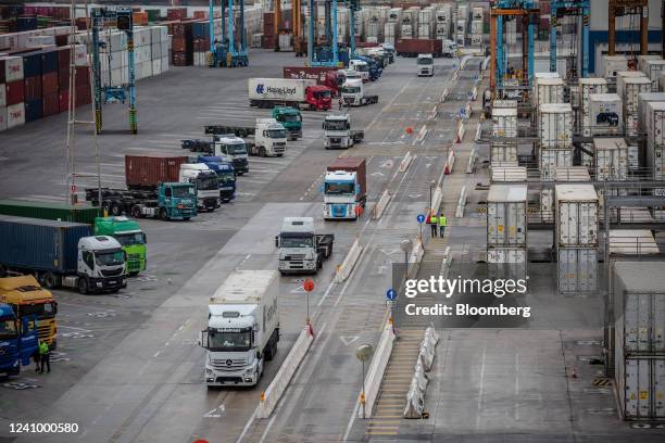 Trucks deliver shipping containers at the Muelle Sur terminal, operated by APM Terminals, at the Port of Barcelona in Barcelona, Spain, on Friday,...
