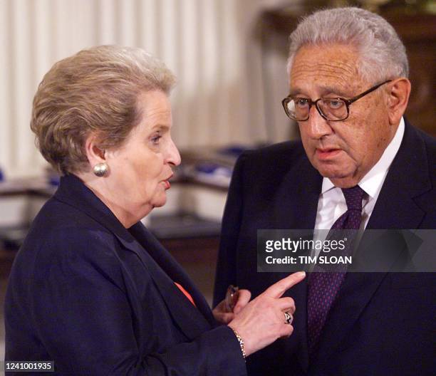 Secretary of State Madaline Albright greets former Secretary of State Henry Kissinger before the Presidential Medal of Freedom ceremony in the East...