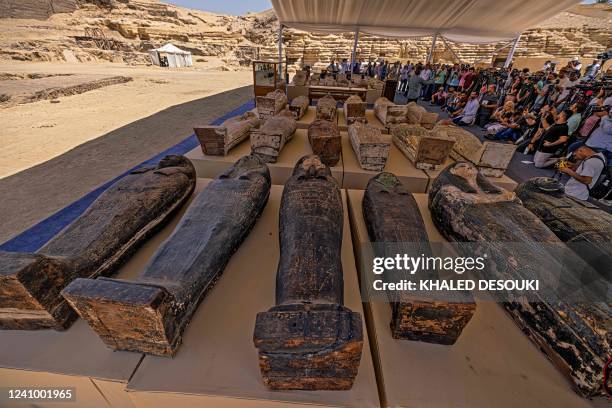 Sarcophaguses found in a cache dating to the Egyptian Late Period are displayed after their discovery by a mission headed by Egypt's Supreme Council...