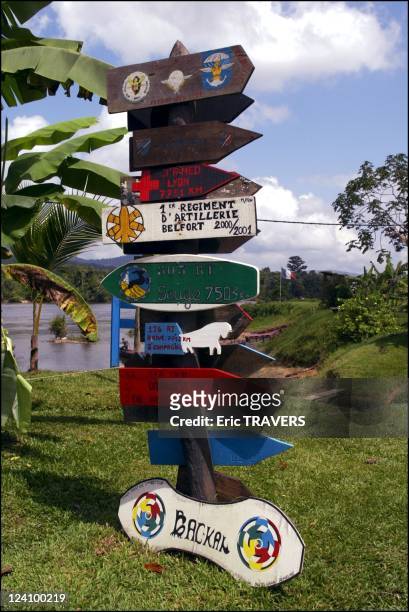 Life on the Maroni river In French Guiana On August 19, 2002 - Signpost indicating direction and distances at the entrance of the camp of the 9th...