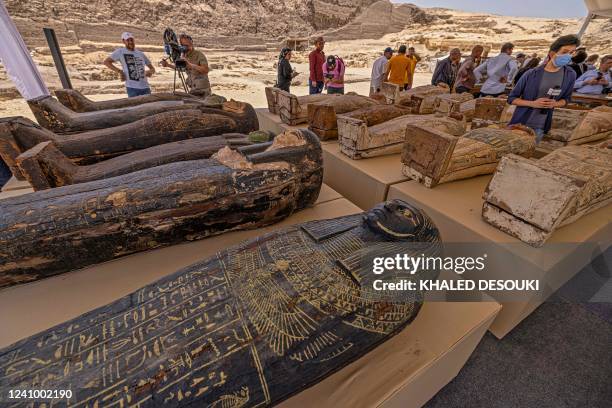 Sarcophaguses found in a cache dating to the Egyptian Late Period are displayed after their discovery by a mission headed by Egypt's Supreme Council...