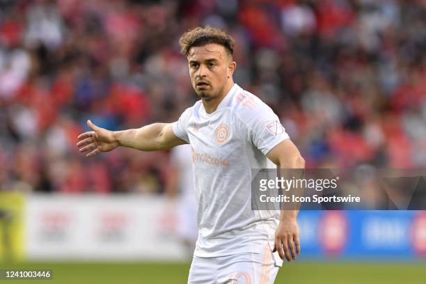 Chicago Fire midfielder Xherdan Shaqiri call out instructions to his teammates in the second half during the MLS Soccer regular season game between...