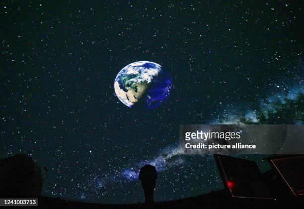 May 2022, Brandenburg, Potsdam: The Earth with starry sky and Milky Way will be projected into the dome of Potsdam's Urania Planetarium by the new...