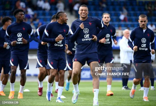 France's forward Kylian Mbappe takes part in a training session in Clairefontaine-en-Yvelines on May 30, 2022 as part of the team's preparation for...