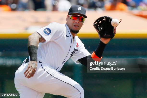 Shortstop Javier Baez of the Detroit Tigers fields a chopper hit by Gary Sanchez of the Minnesota Twins, then throws out Jorge Polanco at second...