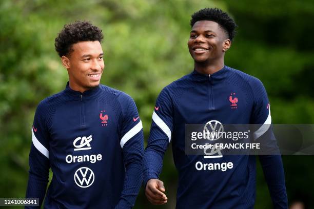 France's midfielder Boubacar Kamara and Fance's midfielder Aurelien Tchouameni arrive for a training session in Clairefontaine-en-Yvelines on May 30,...