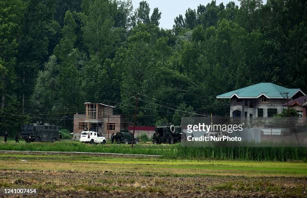 Indian army vehicles are seen near the site of gun-battle in south Kashmir's Pulwama on May 30, 2022.Two militants of Jaish-e-Muhammad militant...