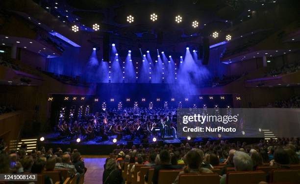 Gavin Greenaway, conducts the Sinfonietta Cracovia Orchestra during the Wojciech Kilar Award Ceremony. John Powell, an Anglo-American composer, best...