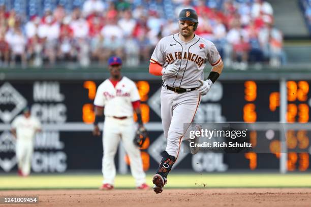 Curt Casali of the San Francisco Giants rounds the bases on his two-run home run in the 10th inning against the Philadelphia Phillies at Citizens...