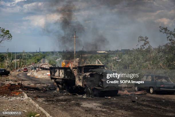 Destroyed truck can be seen on fire near the bridge connecting Severodoonetsk and Lysychansk, Luhansk. As Russian troops launching the offensive from...