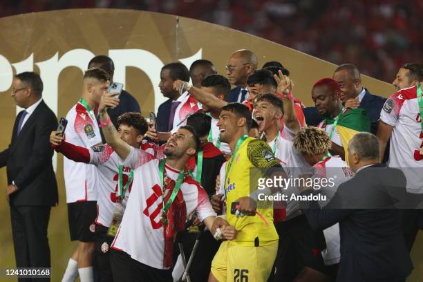 Players of Wydad Casablanca celebrate after winning the CAF Champions League final match between Al Ahly and Wydad Casablanca at Stade Mohammed V in...