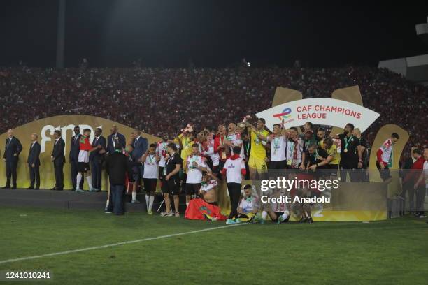 Players of Wydad Casablanca celebrate after winning the CAF Champions League final match between Al Ahly and Wydad Casablanca at Stade Mohammed V in...