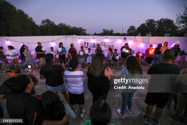 People attend a candlelight vigil in Uvalde, Texas, United States on May 30 remembering the victims of a school shooting where 19 children and two...