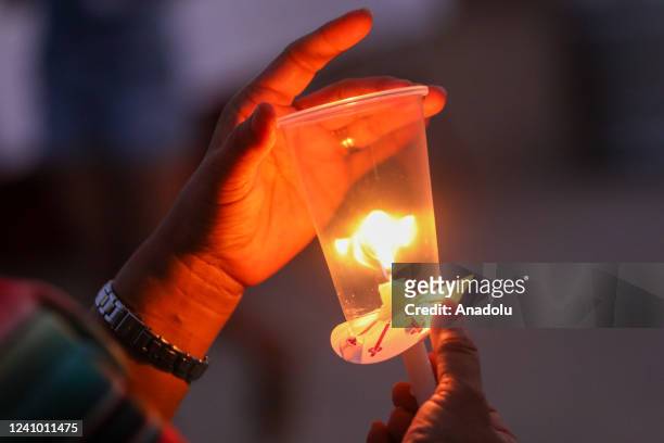 Photo of a candle from a candlelight vigil in Uvalde, Texas, United States on May 30 remembering the victims of a school shooting where 19 children...