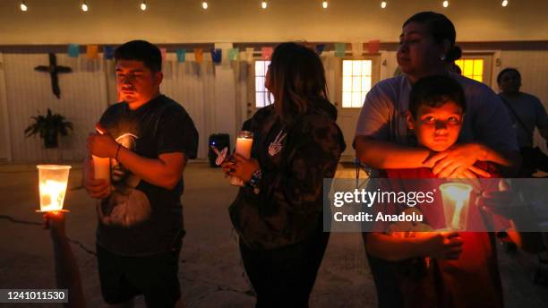 People attend a candlelight vigil in Uvalde, Texas, United States on May 30 remembering the victims of a school shooting where 19 children and two...