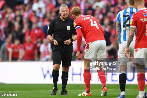 Referee, Jonathan Moss has words with Joe Worrall of Nottingham Forest during the Sky Bet Championship Play-Off Final between Huddersfield Town and...