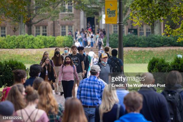 William & Mary students walk across campus between classes, Monday, October 25, 2021 in Williamsburg, Virginia.