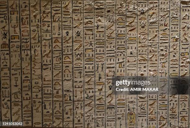 This picture taken on January 18, 2022 shows hieroglyphic Egyptian writing on the walls of KV9, the Tomb of Pharaohs Ramses V and Ramses VI , at the...