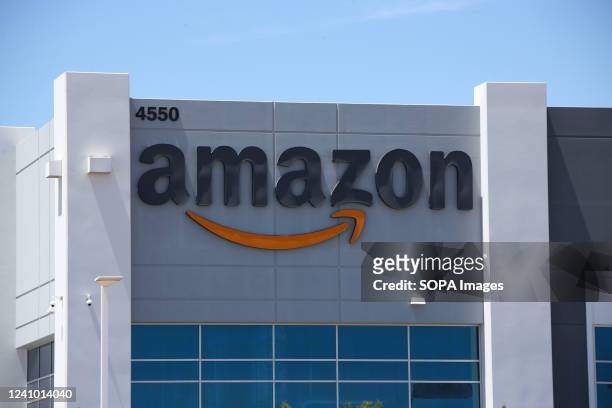 An Amazon logo is displayed on a fulfillment center. Being the world's largest online retail company, Amazon operates more than 175 fulfillment...