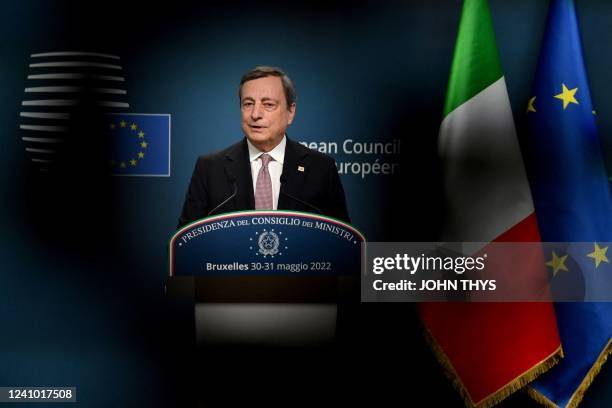 Italy's Prime Minister Mario Draghi addresses a press conference at the end of an European Union summit on Ukraine, defence and energy, in Brussels...