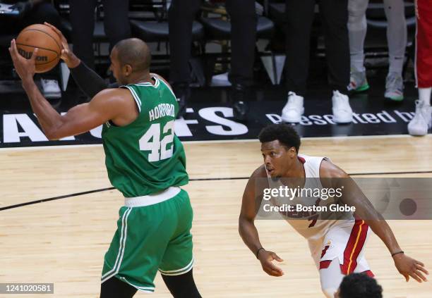 Boston Celtics center Al Horford rebounds Miami Heat forward Jimmy Butler go ahead three point attempt in front of Heat guard Kyle Lowry during the...