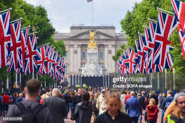 Crowds descend on The Mall as The Queen's Platinum Jubilee preparations near completion at Buckingham Palace, marking the 70th anniversary of the...