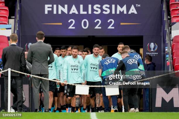 Lionel Messi of Argentina and the other players come onto the playing field piror to the Finalissima 2022 Argentina Training Session at Wembley...