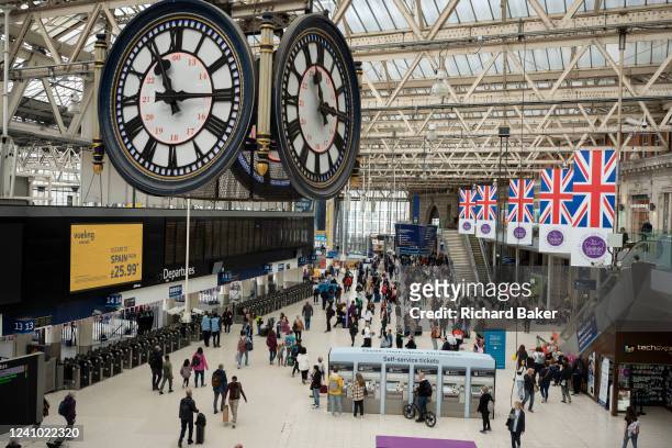 Union Jack banners hang above the concourse of Waterloo Station as preparations continue for the Queen's Platinum Jubilee celebrations in the...