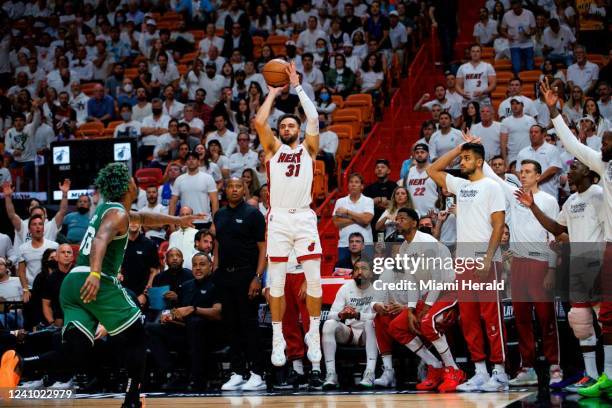 Miami Heat guard Max Strus hits a three-pointer against Boston Celtics guard Marcus Smart during the third quarter of Game 7 of the NBA Eastern...