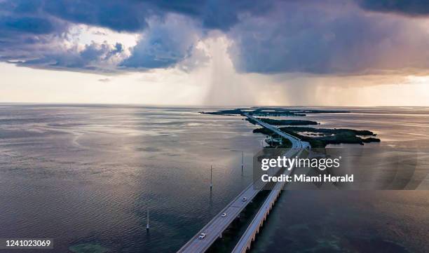 Cars make their way down the Overseas Highways Seven Mile Bridge near Little Duck Key and Bahia Honda State Park on Oct. 11, 2021. A person died in a...