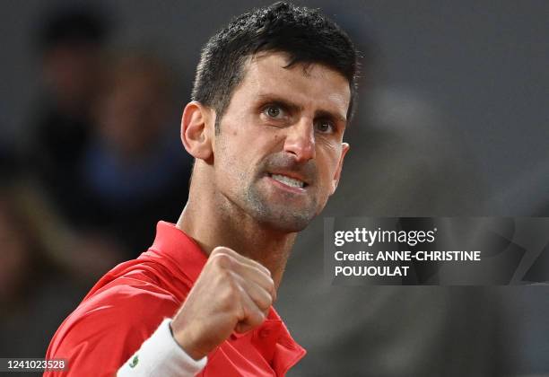 Serbia's Novak Djokovic reacts as he plays against Spain's Rafael Nadal during their men's quarter-final singles match on day ten of the...