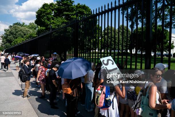 Fans, the BTS Army as they are called, of the South Korean pop group BTS, or Bantam Boys, line the security fencing of the White House hoping to...