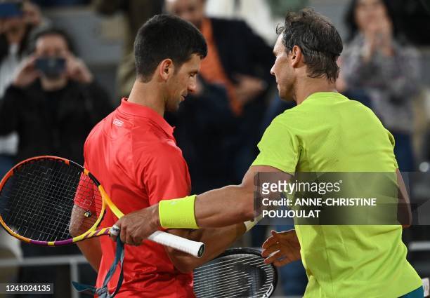 Spain's Rafael Nadal shakes hands with Serbia's Novak Djokovic after winning at the end of their men's singles match on day ten of the Roland-Garros...