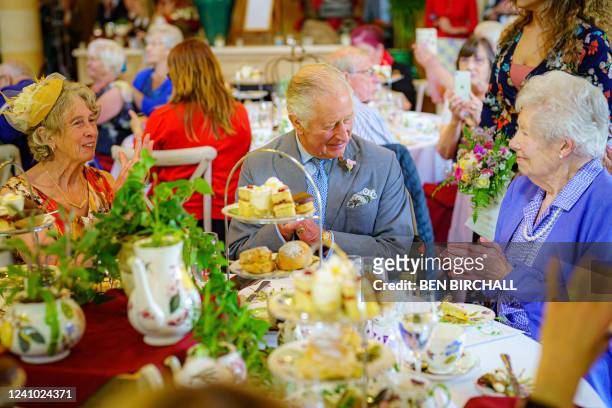 Britain's Prince Charles, Prince of Wales meets Elizabeth Powell who celebrated her 100th birthday on May 6th 2022, during a tea dance hosted by The...