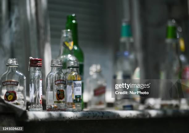 Empty vodka and beer bottles left in the window of a building in Krakow's Kazimierz. On Tuesday, May 31 in Krakow, Poland.