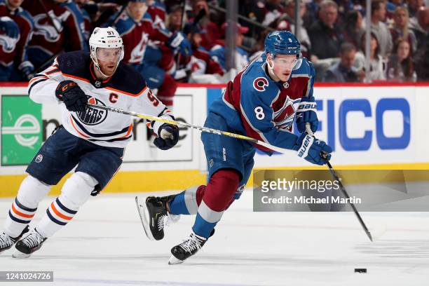 Cale Makar of the Colorado Avalanche skates against Connor McDavid of the Edmonton Oilers in Game One of the Western Conference Final of the 2022...