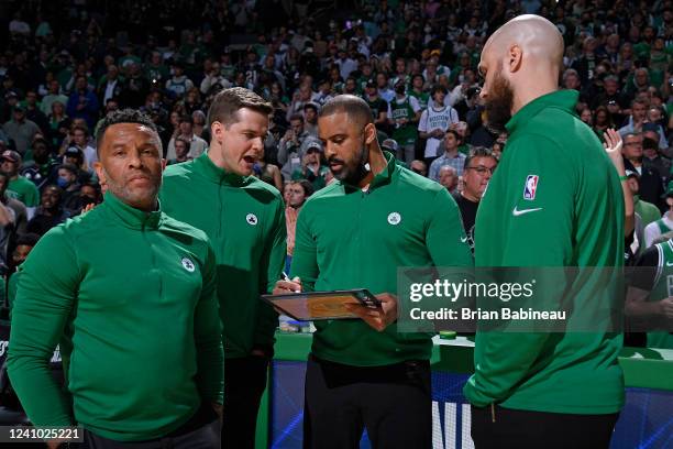 Head Coach Ime Udoka talks to Assistant Coaches Damon Stoudamire, Will Hardy, and Ben Sullivan of the Boston Celtics during Game 4 of the 2022 NBA...