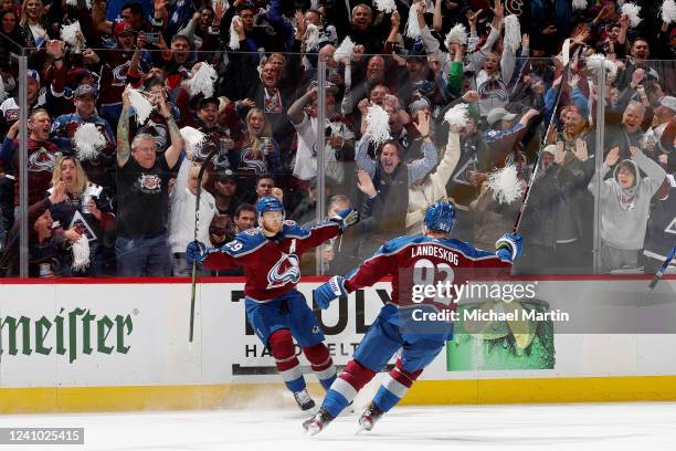 Nathan MacKinnon and Gabriel Landeskog of the Colorado Avalanche celebrate a goal against the Edmonton Oilers in Game One of the Western Conference...