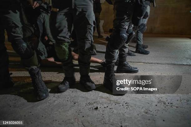 Border Police soldiers arrest a Palestinian youth at Sheikh Jarrah. About 70,000 right-wing Israelis participated in one of the biggest flag marches...