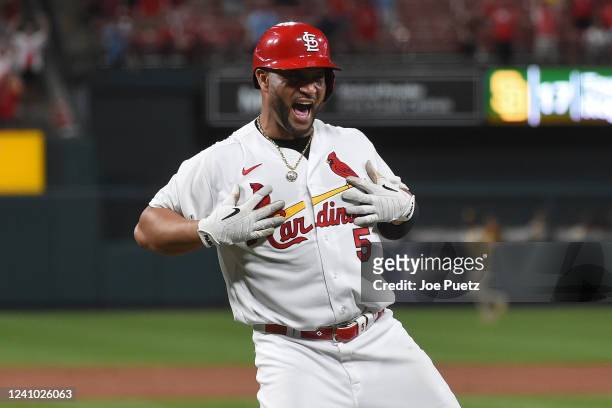 Albert Pujols of the St. Louis Cardinals reacts after hitting a walk-off sacrifice fly against the San Diego Padres during the tenth inning at Busch...