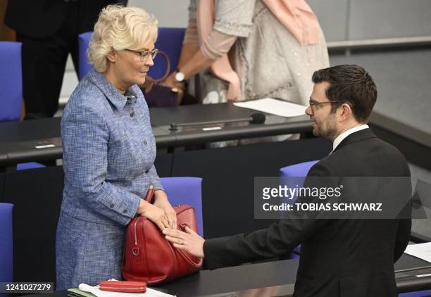 German Defence Minister Christine Lambrecht and German Justice Minister Marco Buschmann talk prior a budget debate at the Bundestag in Berlin on June...
