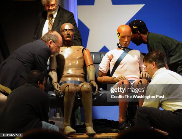 Washington, DC Workers move a display of actual crash test dummies donated by General Motors on the 25th anniversary of the launching of the Vince...