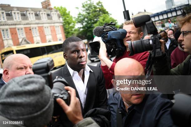 West Ham's French defender Kurt Zouma arrives at the Thames Magistrates' Court, in London, on June 1, 2022 to attend his sentencing for kicking and...