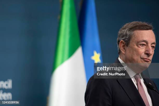 Mario Draghi Prime Minister of Italy talks at a press conference to the media after the end of the 2-day extraordinary special EU summit about...