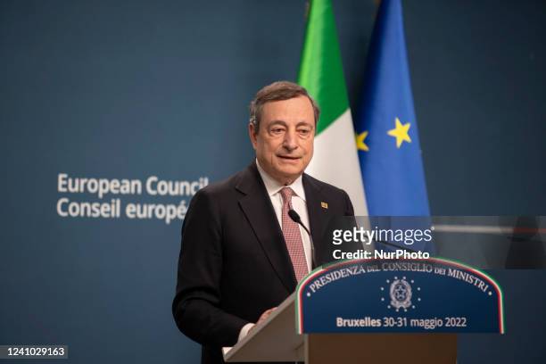 Mario Draghi Prime Minister of Italy talks at a press conference to the media after the end of the 2-day extraordinary special EU summit about...