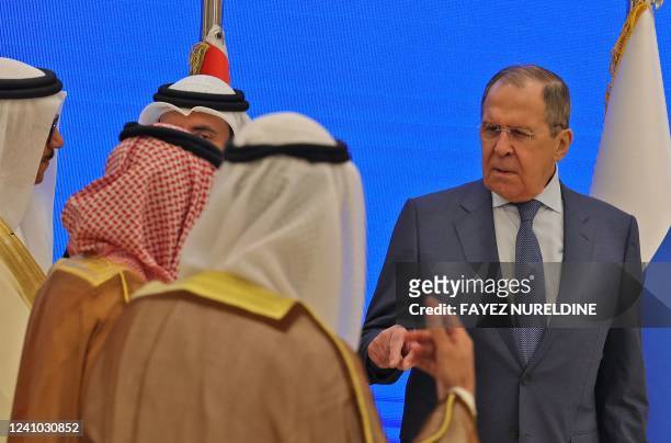 Russian Foreign Minister Sergei Lavrov talks with his Gulf counterparts upon his arrival at the Gulf Cooperation Council meeting, in the Saudi...