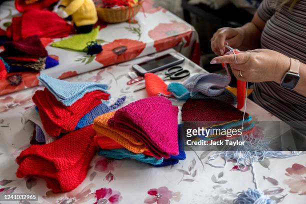 Julie Bartram crochets bunting at the Beccles Community Hub on June 1, 2022 in Beccles, England. The people of Beccles, Suffolk hope to break the...