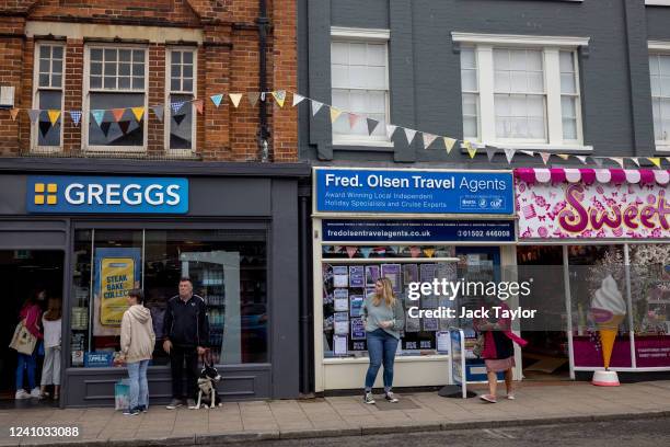 Bunting hangs above high street shops ahead of the Platinum Jubilee of Queen Elizabeth II on June 1, 2022 in Beccles, England. The people of Beccles,...